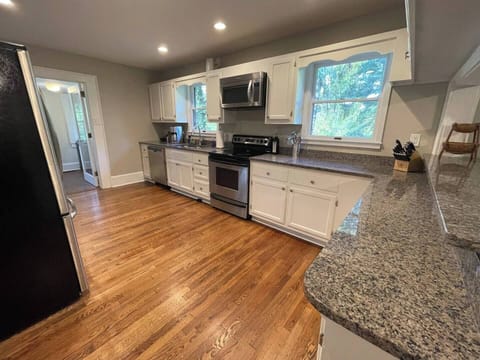 The kitchen is fully stocked! Pots, pans, dishes, coffee maker, kettle, blender, toaster, wine glasses, and more. Make sure you check the pantry for outside plates, cups, and wine glasses.