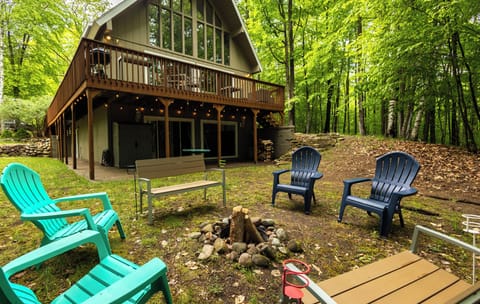 Relax by the fire pit surrounded by lush woods—perfect for summer evenings and s’mores under the stars!