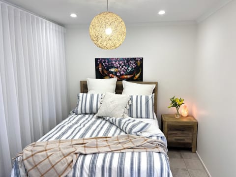 Luxurious sheets, spare blanket, blackout curtains for a serene, restful night.