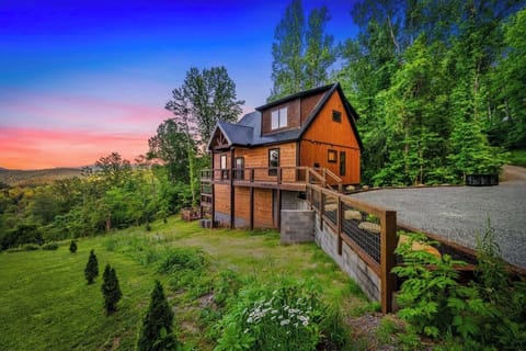 Peaceful getaway tucked in the trees with a spacious deck and gravel drive for easy access.