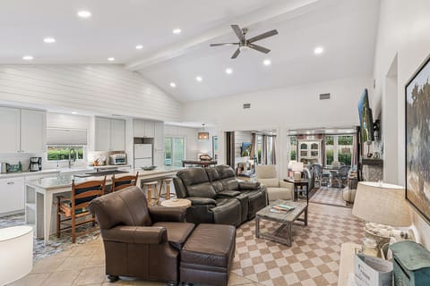 Relax in this bright open-concept space where your living room flows seamlessly into a fully-equipped kitchen, perfect for entertaining.