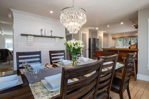 Enjoy meals by the dining table with expansive views through a large window.