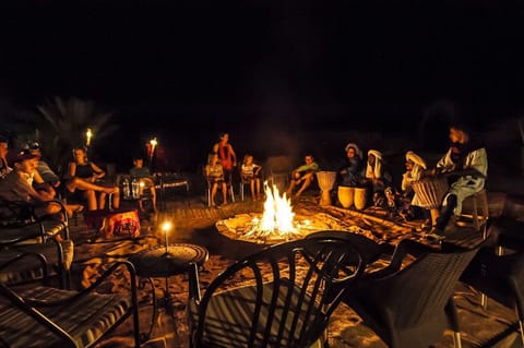 Fireplace of the party night with traditional sahara music 