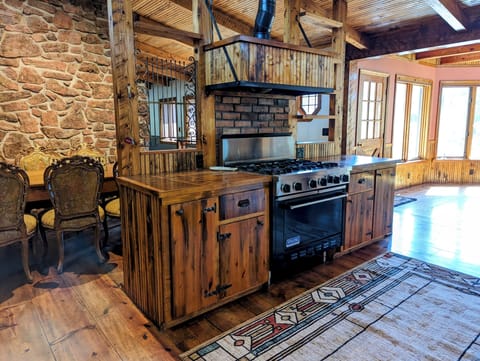 Viking oven with many more kitchen appliances. Microwave, toaster, coffee maker.