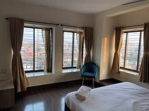 Luxury Room, Private Bathroom, City View | Desk, laptop workspace, blackout drapes, iron/ironing board