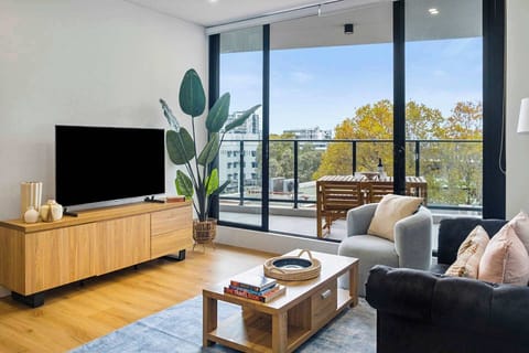Perfectly paired, our inviting couch beckons for relaxation while the television promises endless entertainment.