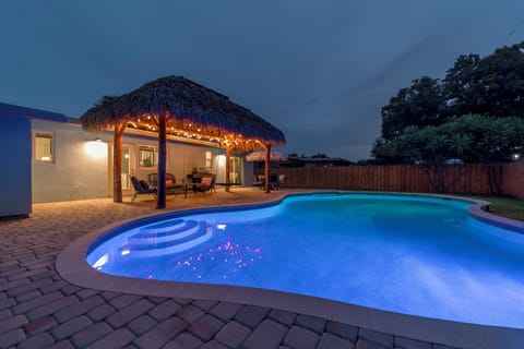 Private pool & Tiki at night.