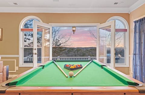 Game Room: Rack up fun with stunning sunset views as you challenge friends to a match!