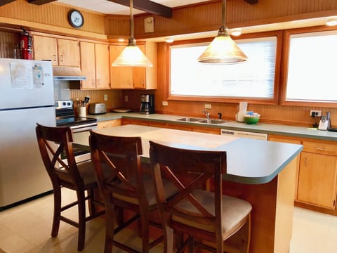 Cottage Inn Kitchen - Kitchen with island seating.