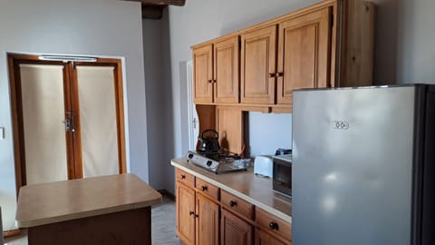 Apartment, Patio, Garden Area | Private kitchen | Full-size fridge, microwave, toaster, cookware/dishes/utensils