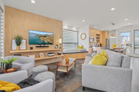 The living room and open floor plan on the main level of the home. 