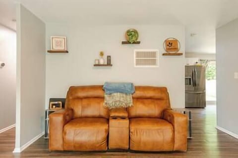 Motorized reclining loveseat with charging ports and cupholder