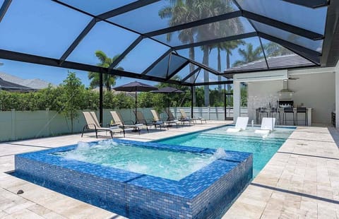Tropical Pool Oasis with Falling Waterfall and Jacuzzi