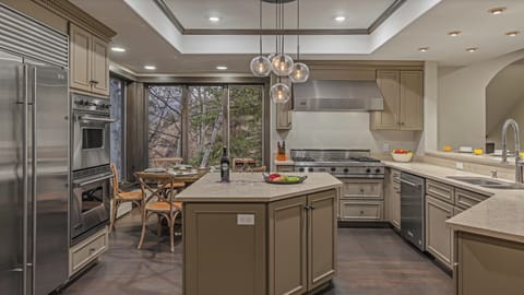 Gourmet kitchen on main level with island, breakfast bar, and breakfast nook