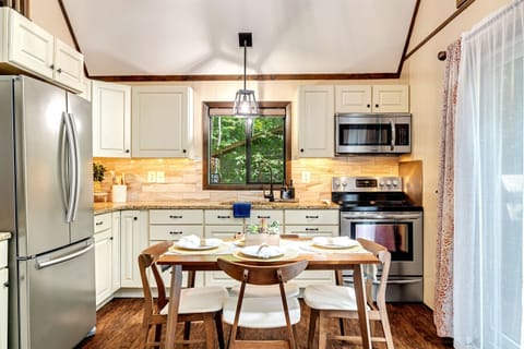 Modern kitchen with stainless steel appliances and granite countertops