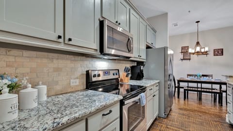 Refrigerator, microwave, and electric stove top.