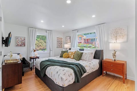 - Spacious bedroom with natural light from two picture windows  
- Plush memory foam bedding 
- Peaceful retreat with a reading nook and smart TV 
