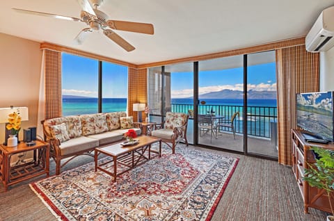 Condo living room featuring panoramic view of famous sandy Kahana beach, Maui!