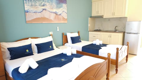 Standard Room, 1 Bedroom, Kitchenette, Courtyard View | Free WiFi, bed sheets