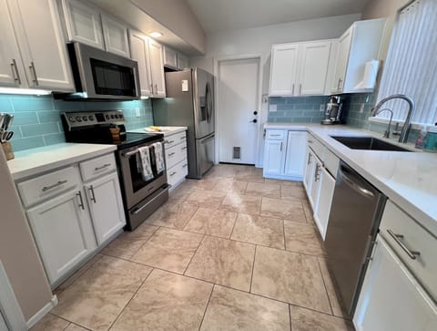 Stainless Steel Refridgerator
Glass Cooktop Stove
Door to Garage