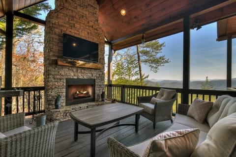 Enjoy the mountain view while relaxing on the comfy outdoor furniture surrounding the wood-burning fireplace on the main level deck. Catch up on your favorite teams with the steaming TV.