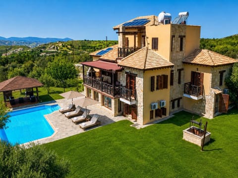 A luxurious hillside villa with a private pool, spacious terraces, and beautiful countryside views.