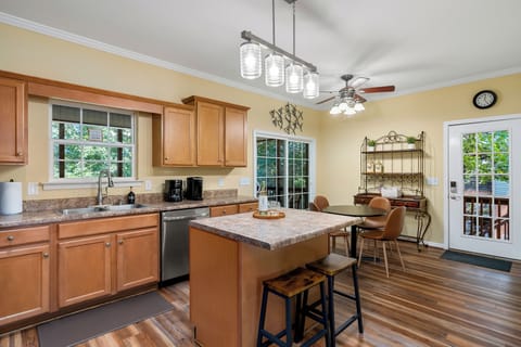 Sliding doors offer direct access to screen porch from fully equipped kitchen.