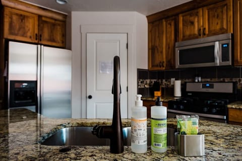 Gas stove and water and ice in fridge.