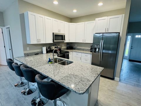 Kitchen with Bar & Four (4) Bar Stools