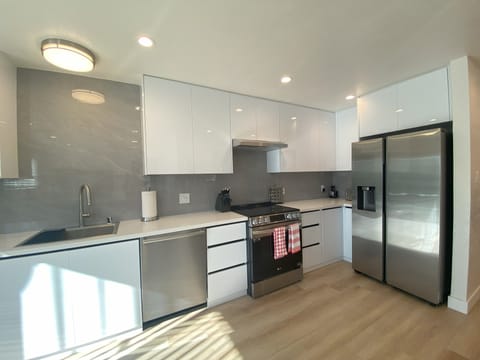 Equip yourself for culinary creations in a spacious kitchen with ample space.