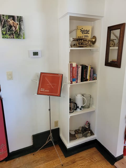 DINING ROOM: The home has a lovely dining room with a dining table, seating for 6 adults, and a wine bar.