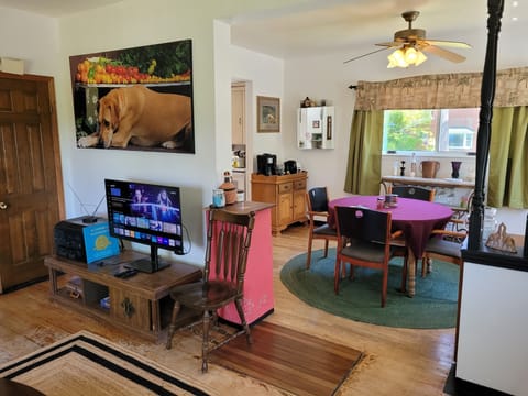 LIVING ROOM: The home has a very cozy living room with 2 sofas, a comfy chair, and a television.