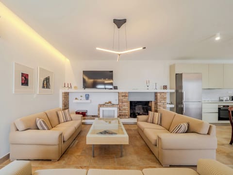 "Gather with loved ones in our elegantly designed living room, a space where comfort and style converge."