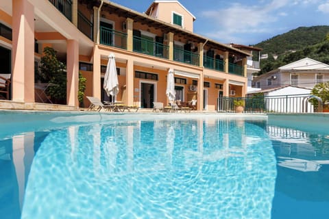 The Sparkling Pool: Enjoy a refreshing swim in the shared pool, complete with sunbeds and umbrellas for ultimate relaxation.