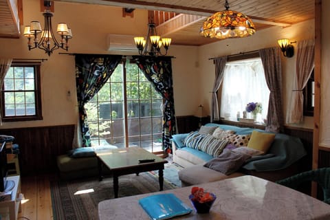 Hollyhock's spacious living room/Blue-purple color, designed with a boy's image. It's a large couch sofa.