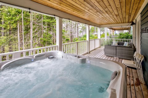 The hot tub sits 6, and sits on the lower balcony of the home. 