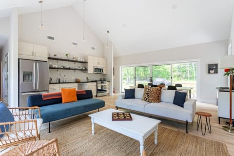 Bright open-concept living with soaring ceilings and plenty of space to gather