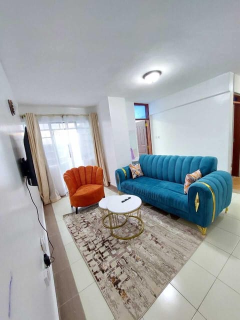 Deluxe Apartment, City View | Living area | 32-inch Smart TV with digital channels