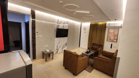 Deluxe Apartment, 2 Bedrooms, Kitchenette | Living area | 45-inch plasma TV with satellite channels