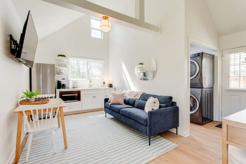Living room, you can see the front door in the background along with the washer and dryer.