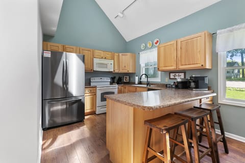 Fully stocked kitchen with a coffee bar