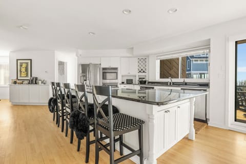 This extra-wide stone-top center island has room with a view - of Lake Michigan!