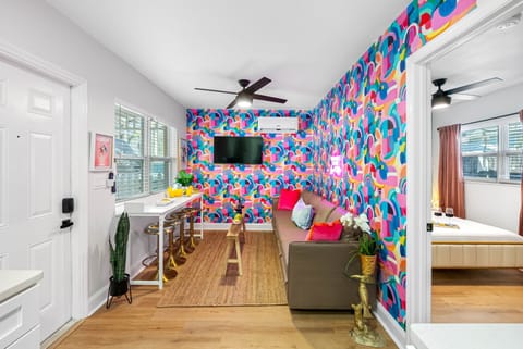 The centerpiece of this dynamic space is a comfortable couch, perfectly positioned to invite you to sit back and unwind.