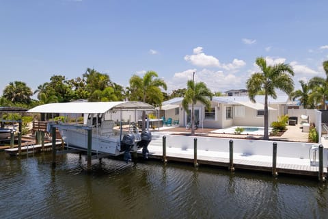 View of home from canal (Guests can use dock, but not boat lift)