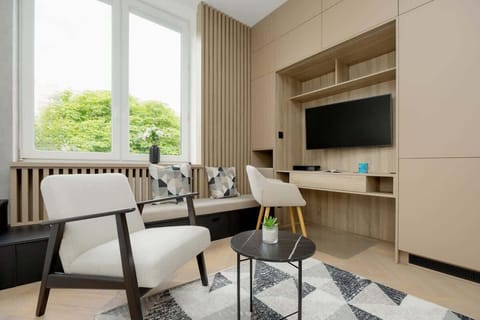 Comfortable living room with cozy seating – Relax after a long day in a modern, minimal space.

