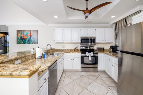 Kitchen wide shot - Spacious, fully equipped kitchen for family meals.