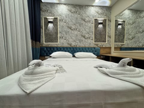 Egyptian cotton sheets, premium bedding, down comforters, minibar