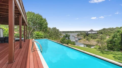 Private swimming pool with sun deck views