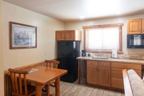Kitchen area with a wood dining table.