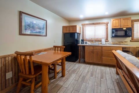 Kitchen area with a wood dining table.